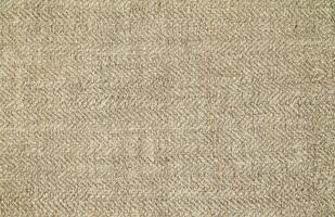 Natural Linen Material Textile Canvas Fabric Texture Background Close-up Detail of Fabric Natural Color Hemp Material Pattern Design Wallpaper. Can be Used as Background or For Graphic Design photo