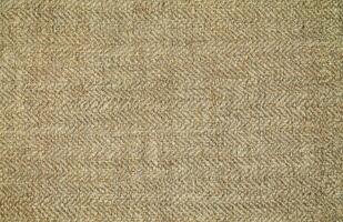 Natural Linen Material Textile Canvas Fabric Texture Background Close-up Detail of Fabric Natural Color Hemp Material Pattern Design Wallpaper. Can be Used as Background or For Graphic Design photo