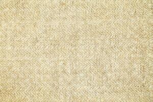 Natural Linen Material Textile Canvas Fabric Texture Background Close-up Detail of Fabric Natural Color Hemp Material Pattern Design Wallpaper. Can be Used as Background or For Graphic Design photo