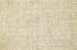 Natural Linen Material Textile Canvas Fabric Texture Background Close-up Detail of Fabric Natural Color Hemp Material Pattern Design Wallpaper. Can be Used as Background or For Graphic Design photo