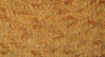 Natural Linen Material Textile Canvas Fabric Texture Background Close-up Detail of Fabric Natural Color Hemp Material Pattern Design Wallpaper. Can be Used as Background or For Graphic Design photo
