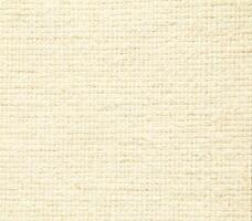 Natural Linen Material Textile Canvas Fabric Texture Background Close-up Detail of Fabric Natural Color Hemp Material Pattern Design Wallpaper. Can be Used as Background or For Graphic Design photo