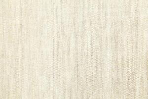 Natural Linen Material Textile Canvas Fabric Texture Background Close-up Detail of Fabric Natural Color Hemp Material Pattern Design Wallpaper. Can be Used as Background or For Graphic Design photo