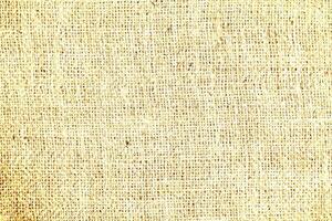 Natural Linen Material Textile Canvas Fabric Texture Background Close-up Detail of Fabric Natural Color Hemp Material Pattern Design Wallpaper. Can be Used as Background or For Graphic Design photo