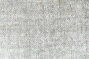 Natural Linen Material Textile Canvas Fabric Texture Background Close-up Detail of Fabric Natural Color Hemp Material Pattern Design Wallpaper. Can be Used as Background or For Graphic Design photo