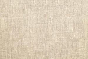 Natural Linen Material Textile Canvas Fabric Texture Background Close-up Detail of Fabric Natural Color Hemp Material Pattern Design Wallpaper. Can be Used as Background or For Graphic Design photo
