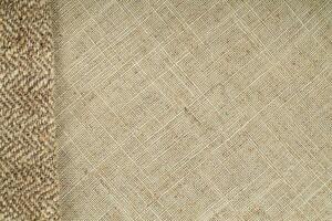Natural Linen Material Textile Canvas Fabric Texture Background Close-up Detail of Fabric Natural Color Hemp Material Pattern Design Wallpaper. Can be Used as Background or For Graphic Design photo