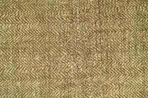 Natural Linen Material Textile Canvas Fabric Texture Background Close-up Detail of Fabric Natural Color Hemp Material Pattern Design Wallpaper. Can be Used as Background or For Graphic Design photo