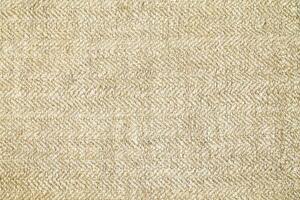 Natural Linen Material Textile Canvas Fabric Texture Background Close-up Detail of Fabric Natural Color Hemp Material Pattern Design Wallpaper. Can be Used as Background or For Graphic Design photo