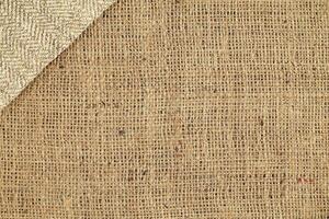 Natural Linen Material Textile Canvas Fabric Texture Background Close-up Detail of Fabric Natural Color Hemp Material Pattern Design Wallpaper. Can be Used as Background or For Graphic Design photo