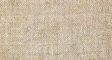 Natural Linen Material Textile Canvas Fabric Texture Background Close-up Detail of Fabric Natural Color Hemp Material Pattern Design Wallpaper. Can be Used as Background or For Graphic Design photo