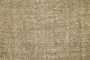 Natural Linen Material Textile Canvas Fabric Texture Background Close-up Detail of Fabric Natural Color Hemp Material Pattern Design Wallpaper. Can be Used as Background or For Graphic Design photo