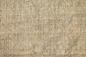 Natural Linen Material Textile Canvas Fabric Texture Background Close-up Detail of Fabric Natural Color Hemp Material Pattern Design Wallpaper. Can be Used as Background or For Graphic Design photo
