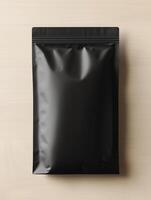 A new black paper packaging bag mockup, on a light wooden table. photo