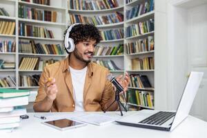 A passionate student immersed in recording a podcast session, surrounded by books in a library setting, conveying a vibe of knowledge and technology. photo
