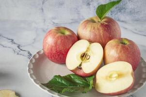 a plate with apples and a slice of apple photo