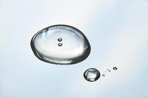 A smear of cosmetic gel close-up on a gray background. photo