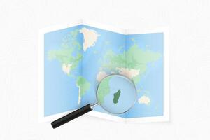 Enlarge Madagascar with a magnifying glass on a folded map of the world. vector