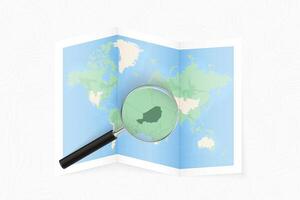 Enlarge Niger with a magnifying glass on a folded map of the world. vector