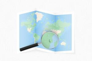 Enlarge Malawi with a magnifying glass on a folded map of the world. vector