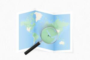 Enlarge Eritrea with a magnifying glass on a folded map of the world. vector
