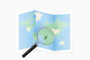Enlarge Congo with a magnifying glass on a folded map of the world. vector