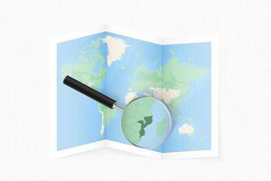 Enlarge Mozambique with a magnifying glass on a folded map of the world. vector