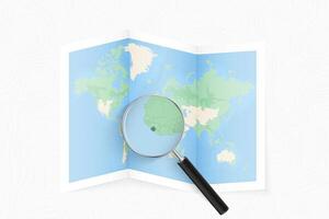 Enlarge Sierra Leone with a magnifying glass on a folded map of the world. vector