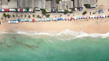 Aerial view of beach with white sand and turquoise water in Bali, Indonesia video