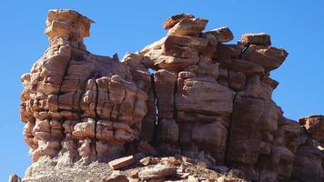 Petrified Forest National Park. Erosion of ancient multi-colored sedimentary rocks from which fossilized sequoias are washed away video
