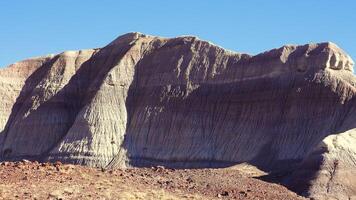Petrified Forest National Park, Erosion of ancient multi-colored sedimentary rocks from which fossilized sequoias are washed away video