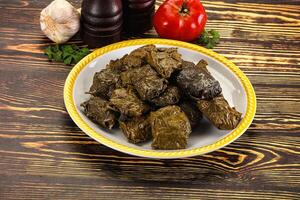 Stuffed dolma - meat in grape leaves photo