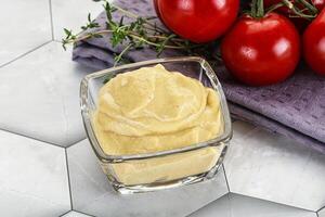 Dijon mustard sauce in the bowl photo