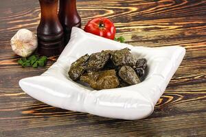 Stuffed dolma - meat in grape leaves photo