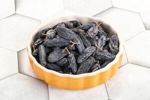 Blue raisin - dry grape berries photo