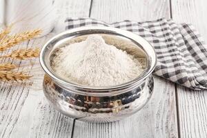 Wheat flour heap for bake photo
