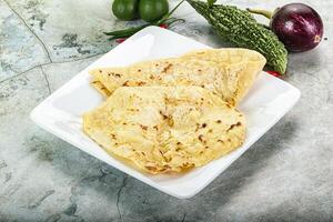 Indian tandori bread - naan with cheese photo