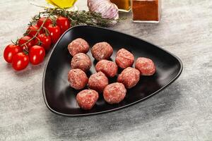 Uncooked raw beef meatball minced photo