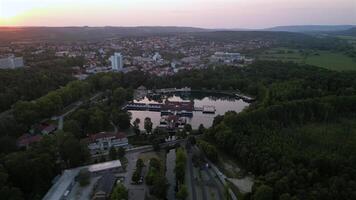 Aerial evening orbiting view of spa lake Heviz in Hungary in July 2024 video