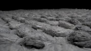 A close-up view of a textured woven fabric. The fabric has a soft, fuzzy texture and appears to be made of natural fibers. video