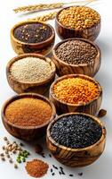 A row of wooden bowls filled with various types of beans and grains. The bowls are arranged in a line, with some of them containing black beans and others containing red beans photo