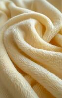 A close up of a fuzzy white blanket. The blanket is soft and fluffy, and it looks like it's been used a lot. The image has a cozy and comfortable feeling to it photo