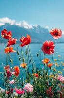 Poppies and wildflowers on the background of the lake and mountains photo