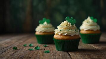 St Patrick s Day cupcakes with clover leaf decorations and cream on a green wooden background close up view with copy space image. photo