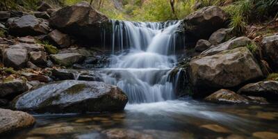 Closeup of a small waterfall, with water gushing down a slope of uneven rocks, creating a dynamic and energizing view. photo