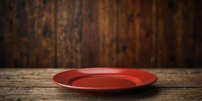 View of a red plate on wood background with copy space image for design. photo