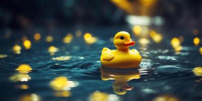 Yellow rubber duck floating in deep blue pool water Playful and tranquil summer scene. photo