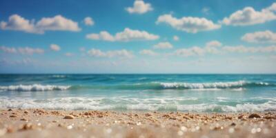 A beach scene with waves approaching the shore and a vibrant blue sky dotted with clouds. photo