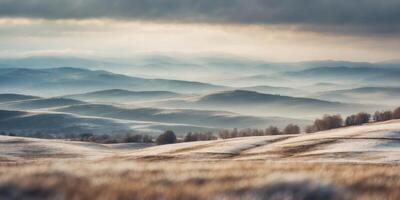 A serene, snowy landscape with gentle, rolling hills under a soft, cloudy sky. photo