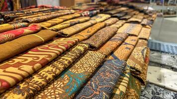 Collection of Handcrafted Batik Fabrics Artfully Created with Canting and WaxBatik cloth is the result of the work of human hands directly using canting as a medium for drawing using wax candles photo